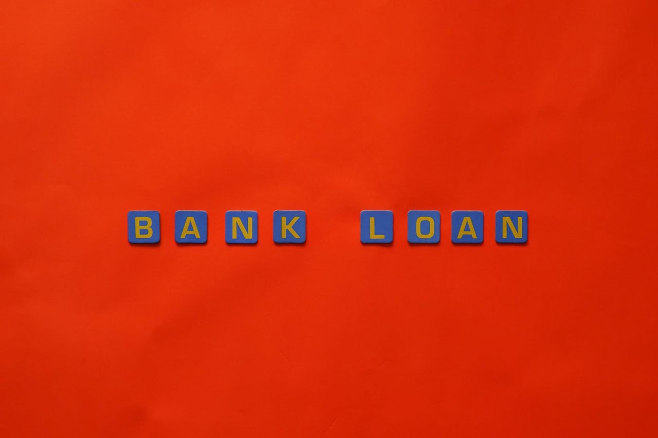 services-01 Letters forming 'Bank Loan' on a vibrant red surface, ideal for finance themes.