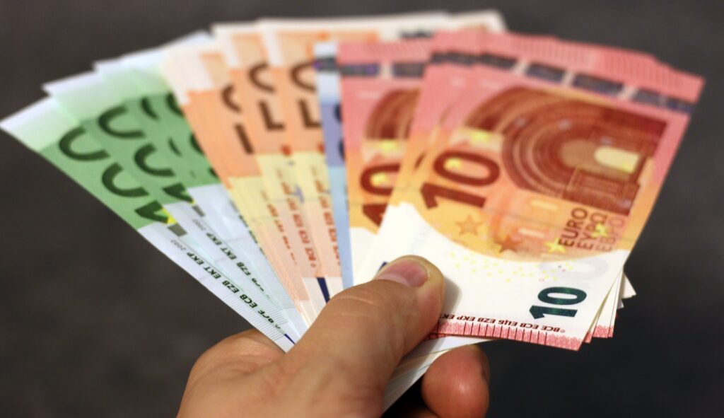 pexels photo 259251 259251 A fan of euro banknotes in various denominations held in a hand.